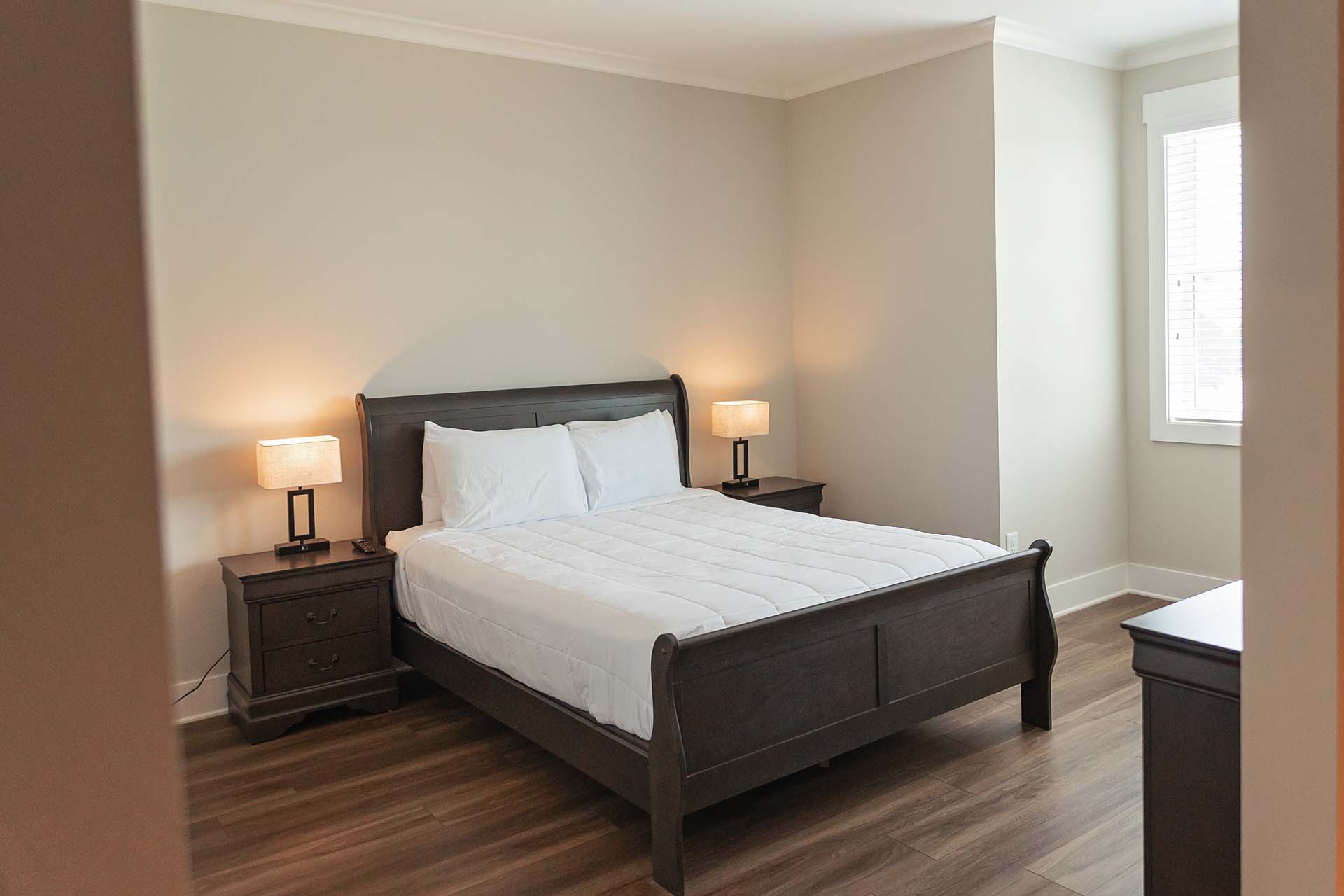 Suite bedroom with a queen bed