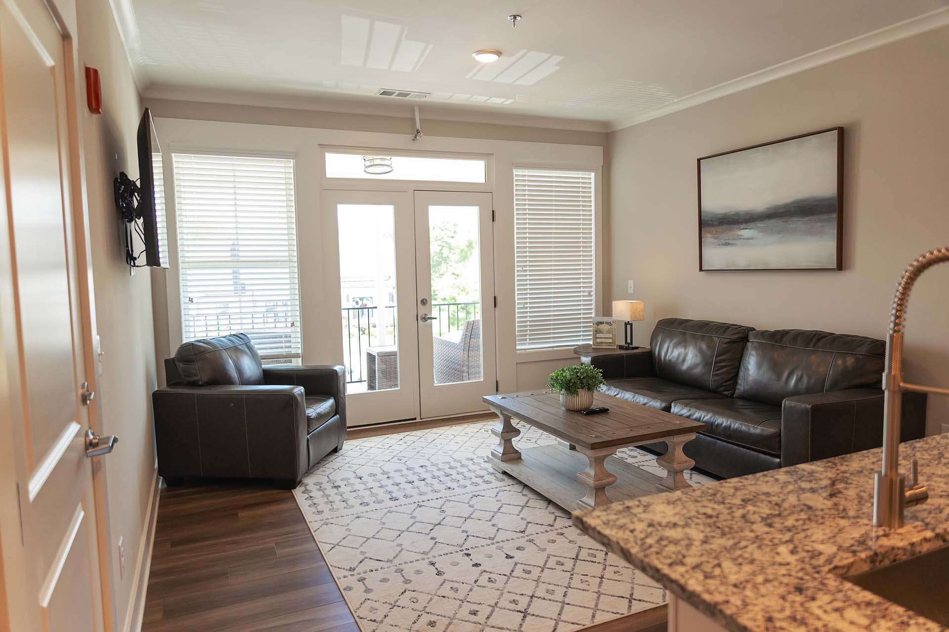 Suite common area with a sofa